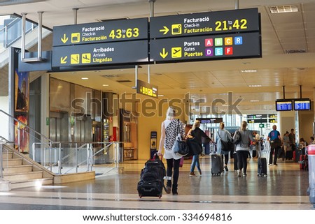 VALENCIA, SPAIN - OCTOBER 12, 2015: Airline Passengers inside the Valencia Airport. About 4.98 million passengers passed through the Valencia, Spain airport in 2014.