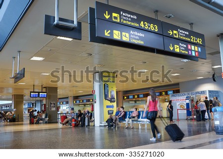 VALENCIA, SPAIN - OCTOBER 12, 2015: Airline Passengers inside the Valencia Airport. About 4.98 million passengers passed through the Valencia, Spain airport in 2014.