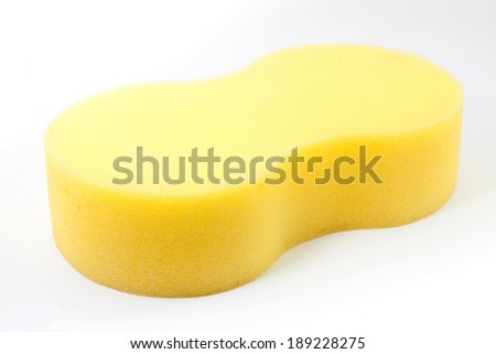 Sponge over white background. Yellow household cleaning sponge.