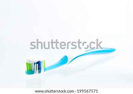 toothbrush with  toothpaste isolated on a white background