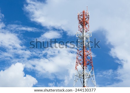 red and white color antenna repeater tower on blue sky with cloud.