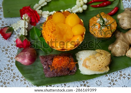 Thai traditional cuisine meal and dessert decorate with Thai style flowers