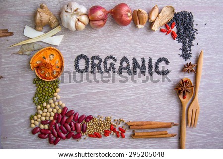 Organic label with various ingredients frame on wooden table