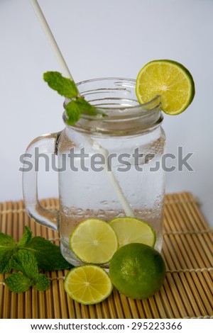 Lemon soda drink in big glass serve with mint and lemon slice