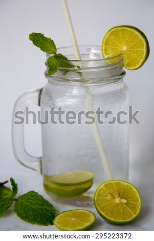 Lemon soda drink in big glass serve with mint and lemon slice
