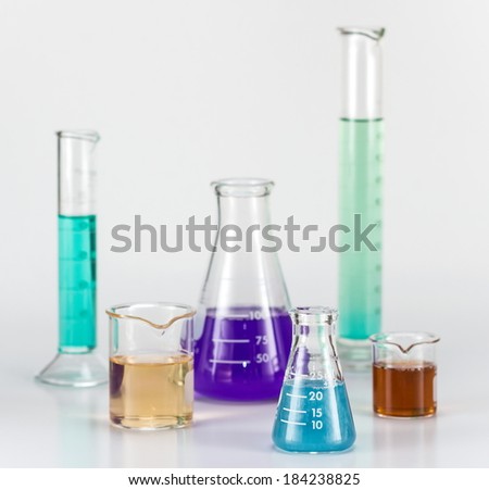 Lab equipment, glassware kit filled with various colored liquids and gels