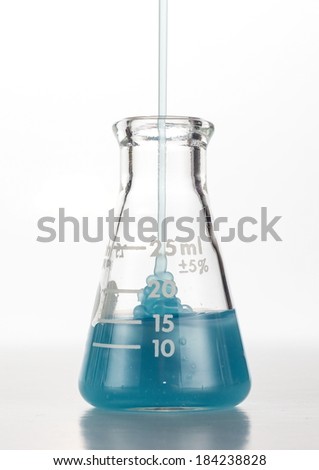 Laboratory glass Erlenmeyer flask getting filled with green gel