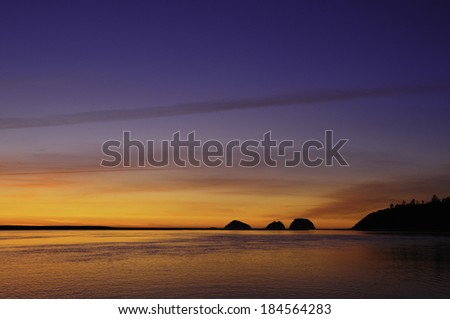 The blue hour begins at sunset Three Arch Rocks on the Pacific Coast of Oregon in the northwest United States