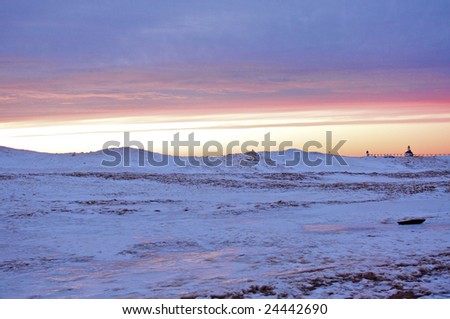 Lighthouse during a Winter Sunset