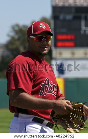KISSIMMEE, FLORIDA - MARCH 6: Carlos Lee of the Houston Astros warms up in the outfield prior to a game against the Atlanta Braves on March 6, 2010 in Kissimmee, Florida
