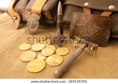 Soviet soldier buckle, spoon, shave and a couple of old soviet coins and red star on a tent