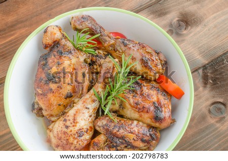 Baked chicken with thyme, soy sauce and garlic on butter