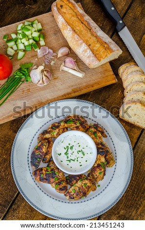 Grilled chicken wings, fresh bread, home garlic and chive with cheese dip