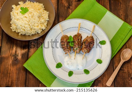 Beef kebab with coriander, garlic, couscous and mint dip