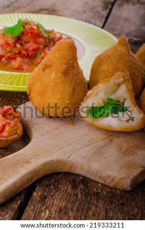 Street food is popular the world over, but the Brazilians is the best.Creamy chicken filling coated in a chicken dough then breadcrumbs - fried perfect and hot tomato salsa