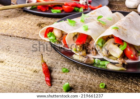Chicken tortilla with mushrooms, garlic and spring onions