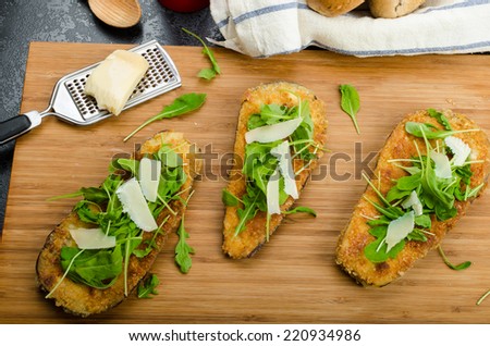 Fried eggplant, fried in parmesan crust, arugula salad with shavings of Parmesan cheese, fresh bread - czech dalamÃ?Â?Ã?Â¡nek
