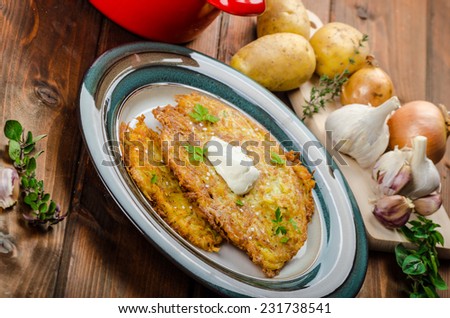 Potato pancakes homemade, garlic, creame fresh up and herbs from garden