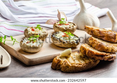 Grilled mushrooms stuffed with blue cheese and chilli and garlic toast