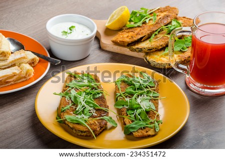 Breaded eggplant parmesan and arugula, fresh limonade from red orange and cheese dip