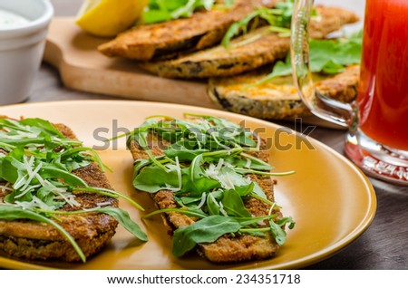 Breaded eggplant parmesan and arugula, fresh limonade from red orange and cheese dip