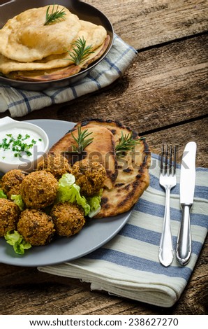 Health crunchy falafel with mint and garlic dip, naan bread with cumin and herbs