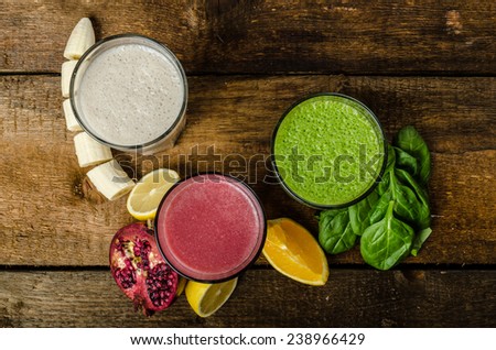 Healthy smoothie - banana-vanilla, pomegranate and orange, spinach and herbs