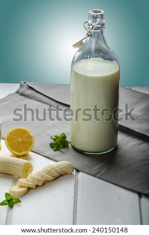 Domestic milk from organic farms, nice background, wood table, ready for your advertisment