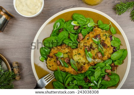 Rabbit steaks with herbs and sour cream, mustard mayonnaise, sprinkled bacon and spring onion, juice serving