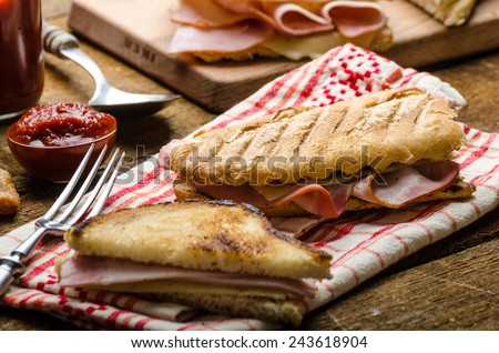 Quick dinner, toast with ham and cheese - panini, english toast, french with butter, dessert delicious churros