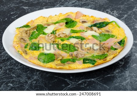 Frittata with ham, mushrooms and spinach, baked toast