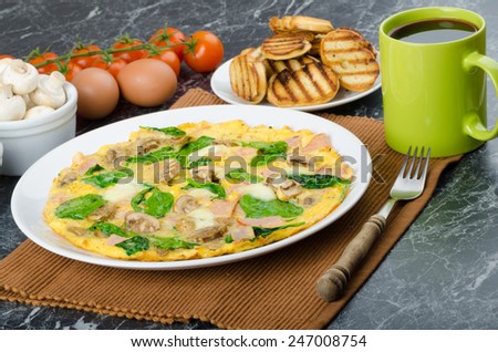 Frittata with ham, mushrooms and spinach, baked toast