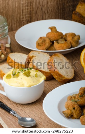 Breaded mushrooms fried with fresh orange juice and homemade tartar sauce