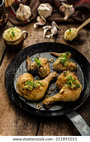 Bio roast chicken with herbs and garlic, couscous, organic garlic from garden