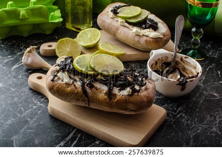 Dark bread spread with cream cheese and caramelized onions. Onion caramelized with sugar and balsamic vinegar - delicious