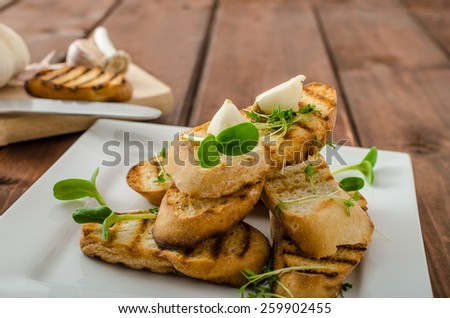 Garlic toast toasted panini sprinkled in microgreens, everything pure organic, eat clean
