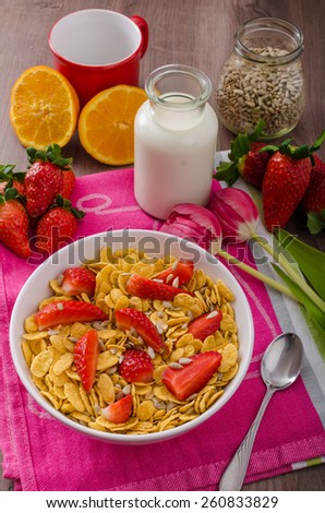 Healthy breakfast cornflakes with milk and strawberries, bio healthy, eat clean