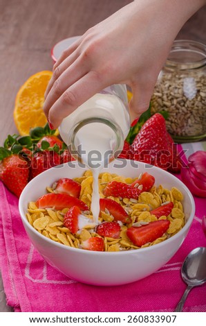 Healthy breakfast cornflakes and strawberries - water milk, bio healthy, eat clean