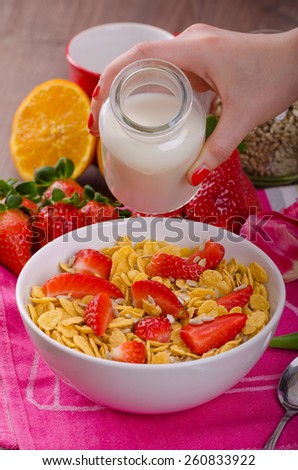 Healthy breakfast cornflakes and strawberries - water milk, bio healthy, eat clean