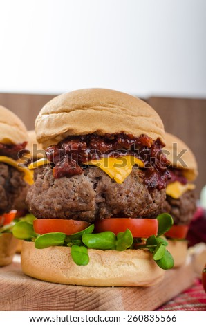 Beef Sliders with homemade barbecue sauce, cheddar, cherry tomatoes and microgreens