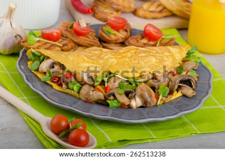 Vegetarian omelet, eat clean food, herbs, microgreens and mushrooms with chilli