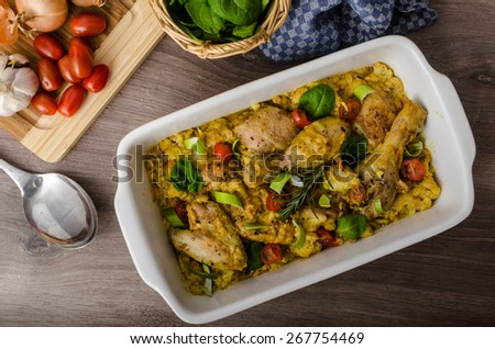 Roasted chicken quarters with curry vegetables, cauliflower, tomatoes and leek