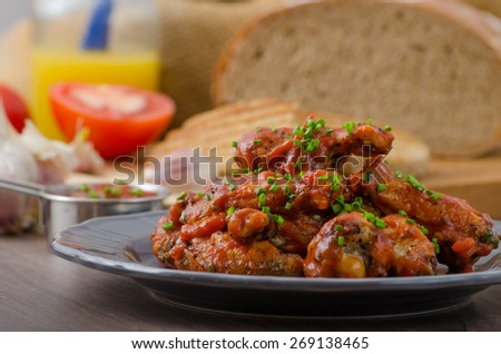 Spicy chicken wings, beer bread panini toast with garlic