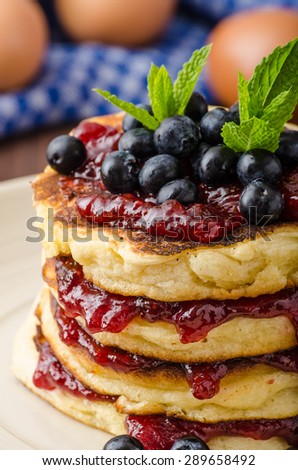 Glutten-free pancakes with jam and blueberries, bio healthy ingredients, fresh mint on top