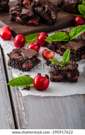 Chocolate brownies with cherries, homemade with just picked cherries and mint