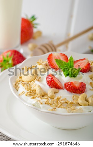 Domestic yogurt with granola strawberries, milk shake