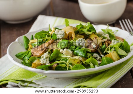 Fresh salad with roasted potatoes, mushrooms and lamb lettuce salad with mustard dip and blue cheese