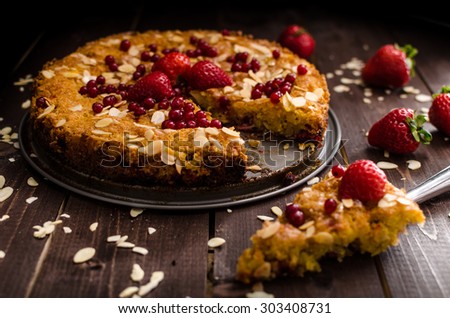 Homemade polenta cake stuffed with raspberries and strawberries