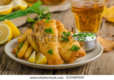 Fish and chips. Fish wrapped in beer batter, herbs dip and czech beer