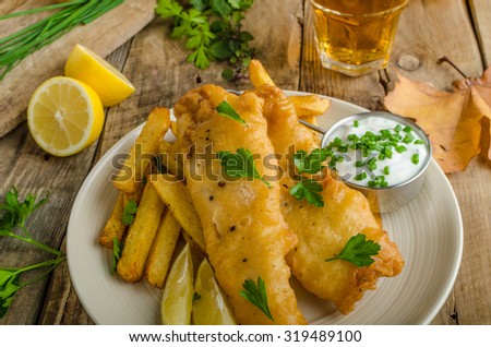 Fish and chips. Fish wrapped in beer batter, herbs dip and czech beer